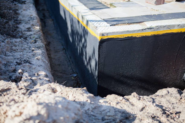 Professional Waterproofing technician working in Bennington, IN